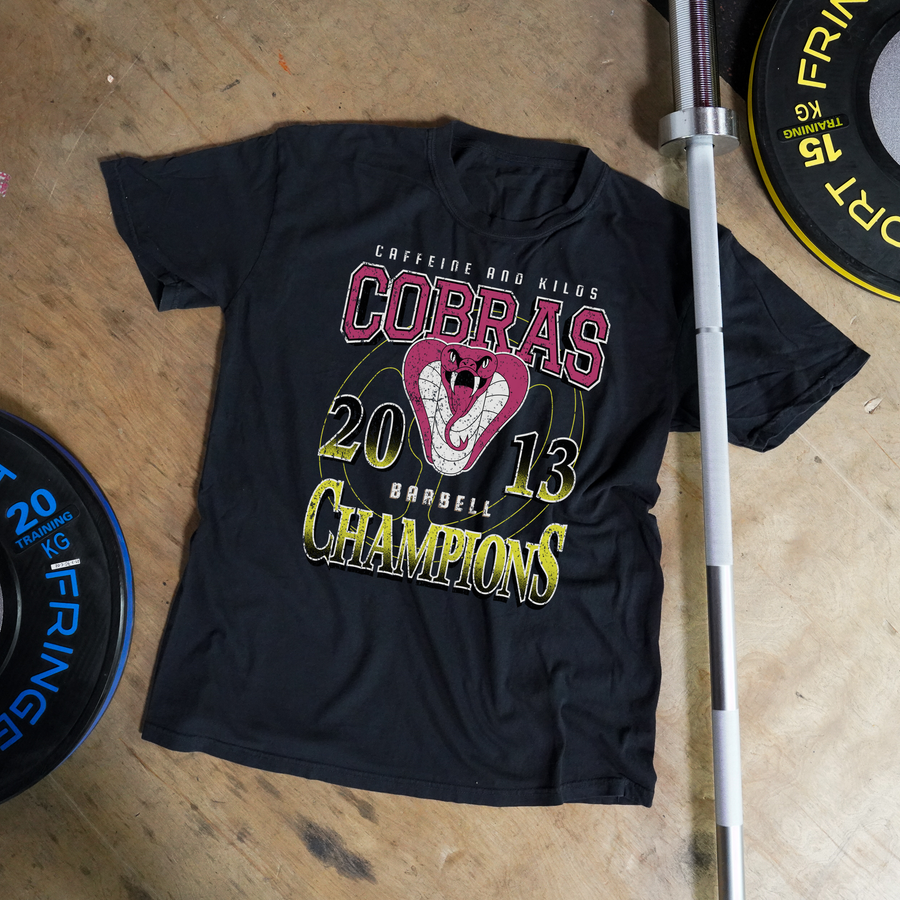 Champions Tee - Outlet