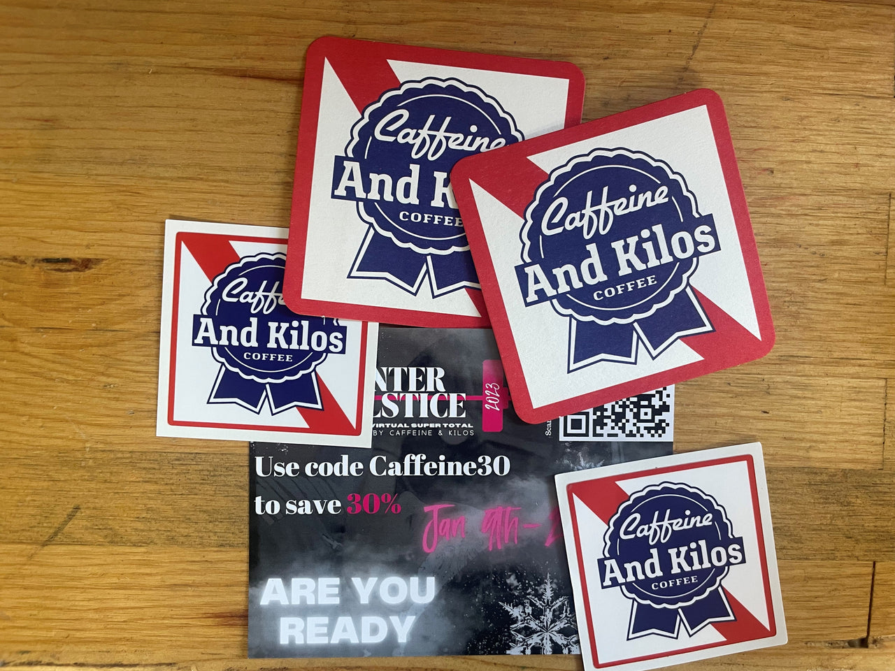 Caffeine and Kilos Inc Bonus Gifts: Stickers, Coasters, & 30% Off Event